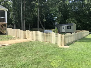 A 4 foot tall concave wood picket fence.