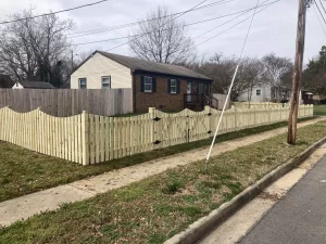 A 4 foot tall concave wood picket fence.