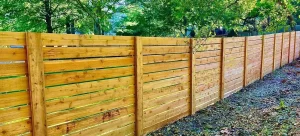 A 6 foot horizontal wood semi-privacy fence.