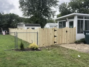 A 6 foot tall concave wood privacy fence.