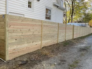 A 6 foot tall horizontal wood privacy fence.