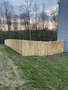 A 6 foot tall shadowbox wood privacy fence.