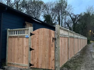 A 6 foot tall cedar cap and trim wood fence with 1 foot of lattice on top.