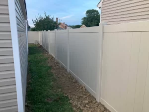 A tan vinyl privacy fence. These are available in any color with a 4 to 5 week preorder.